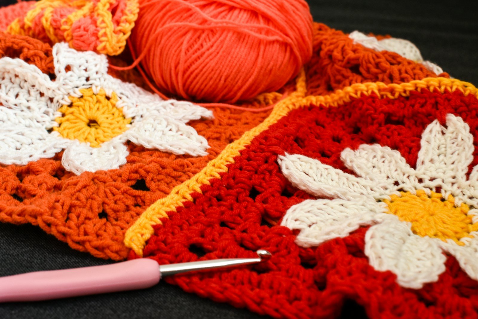 Crocheted squares with yarn and hook